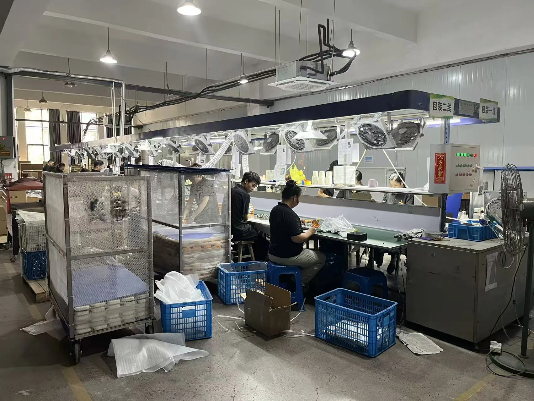 Quanhu assembly workshop with workstations and production equipment