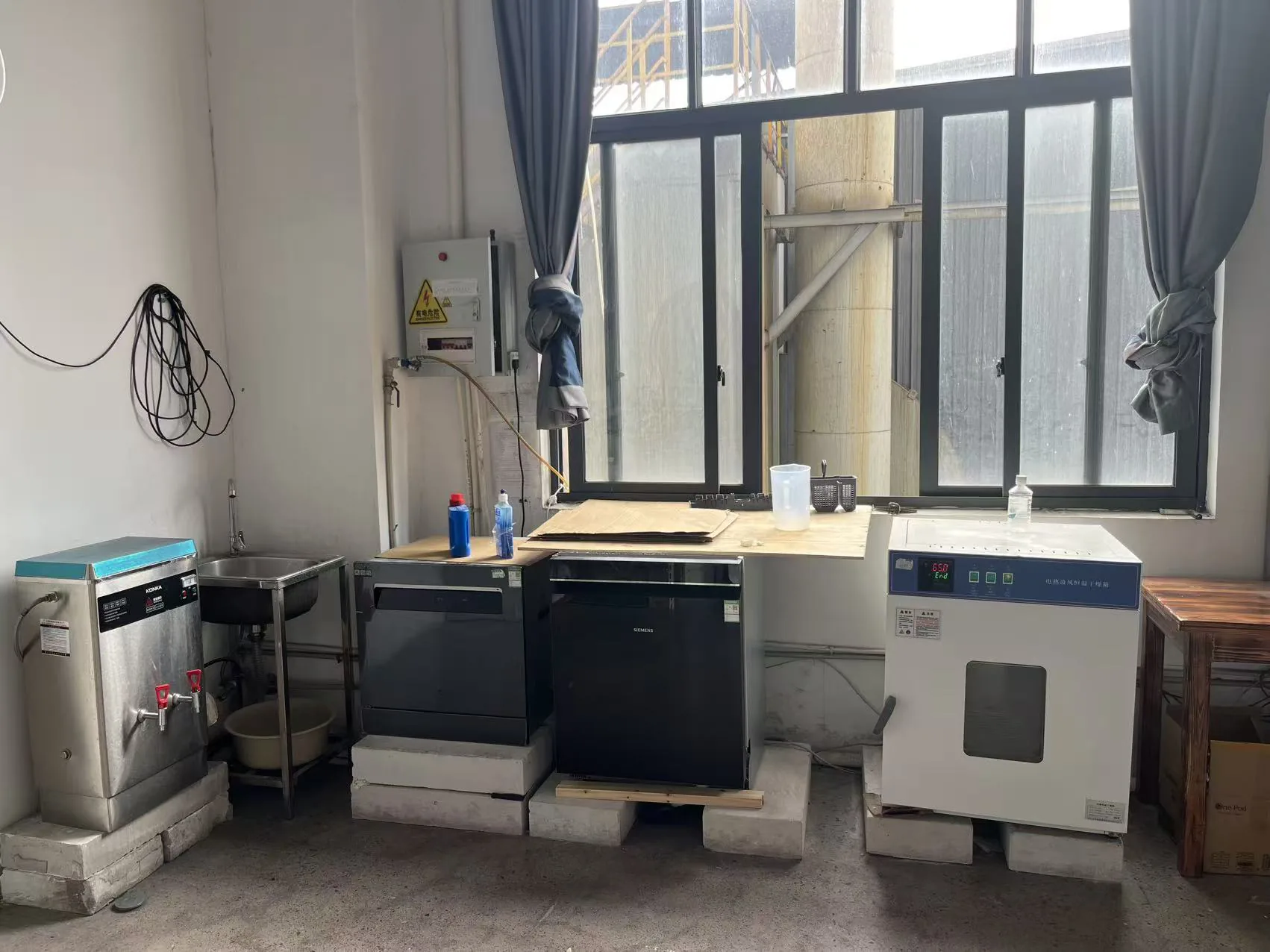 Factory testing area with test chambers and laboratory equipment